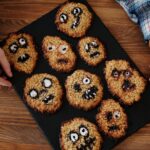 Homemade Halloween cookies shaped like monsters, perfect for a spooky treat.