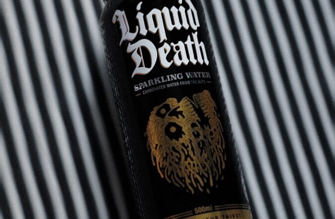 a can of liquid sitting on top of a table